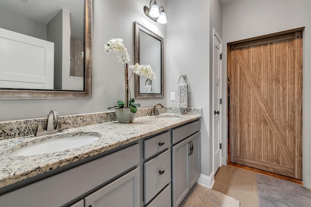 bathroom with vanity and tile patterned floors