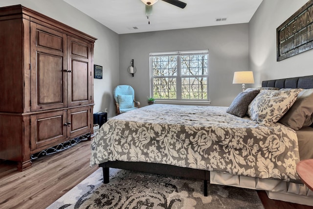 bedroom featuring ceiling fan and light wood-type flooring