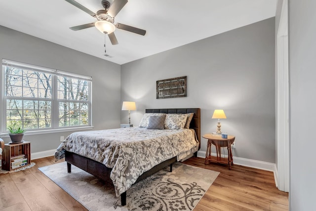 bedroom featuring ceiling fan and light hardwood / wood-style flooring