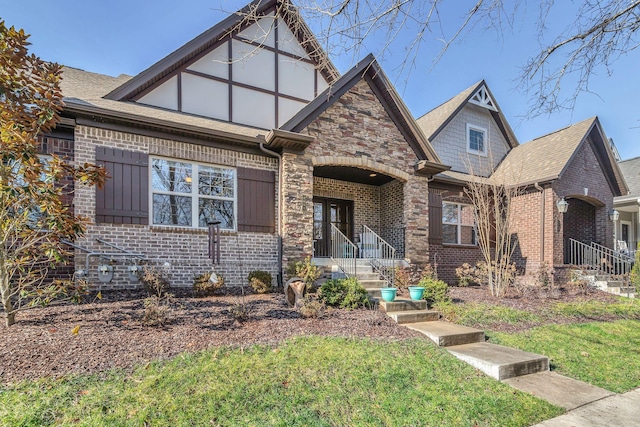 tudor home featuring covered porch