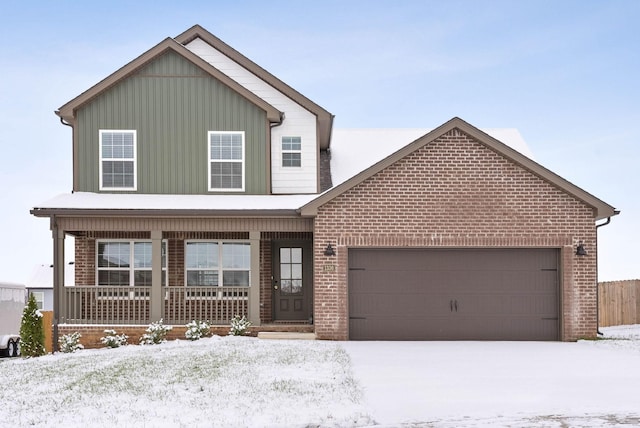 front of property featuring a porch and a garage