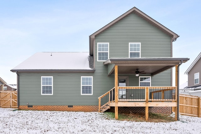 snow covered property featuring ceiling fan