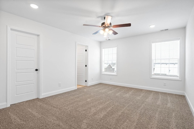 unfurnished room featuring visible vents, baseboards, a ceiling fan, carpet, and recessed lighting