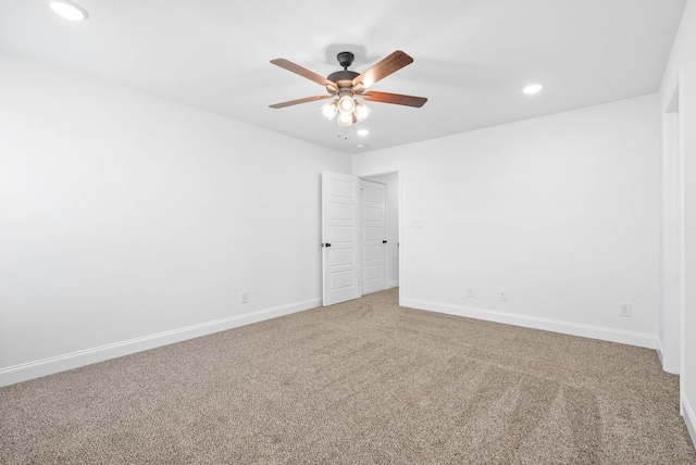 carpeted empty room with a ceiling fan, recessed lighting, and baseboards