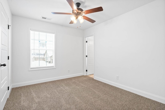 unfurnished room with a ceiling fan, baseboards, visible vents, and carpet flooring