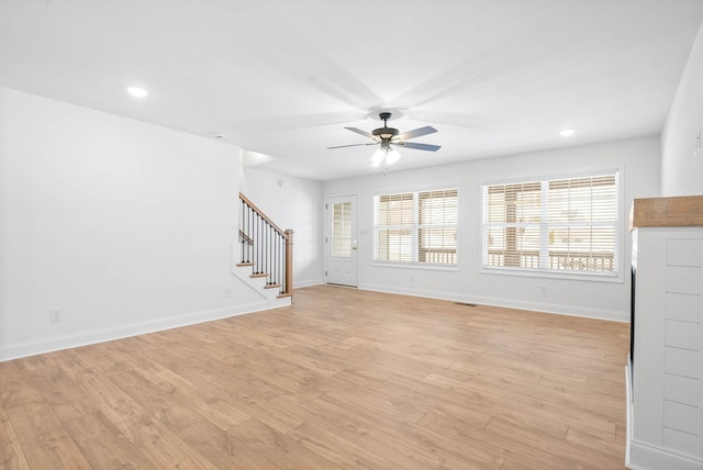 unfurnished living room featuring ceiling fan, a healthy amount of sunlight, and light hardwood / wood-style flooring