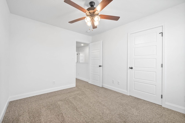 unfurnished bedroom featuring carpet and ceiling fan