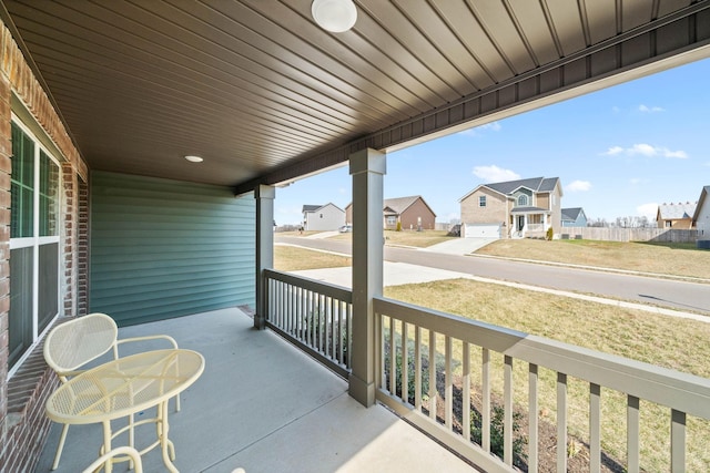 view of patio with a porch and a residential view