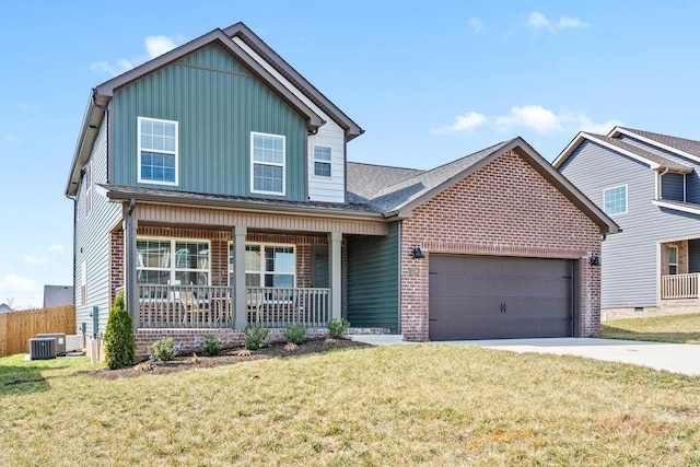 view of front of home featuring an attached garage, covered porch, central AC, driveway, and a front yard