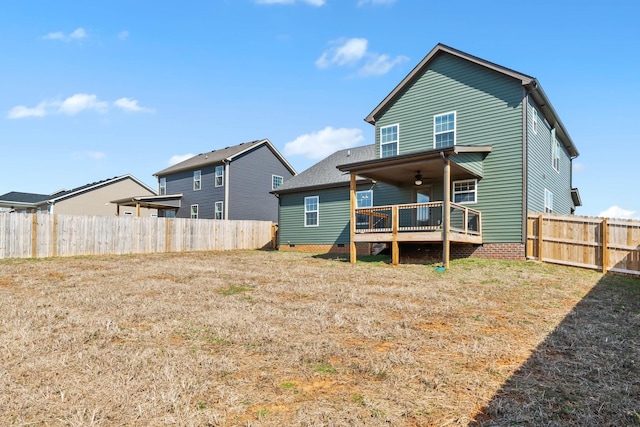 back of property with crawl space and fence