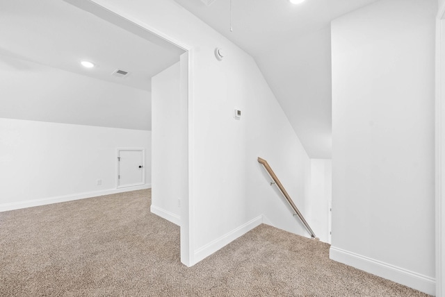 bonus room featuring carpet and lofted ceiling