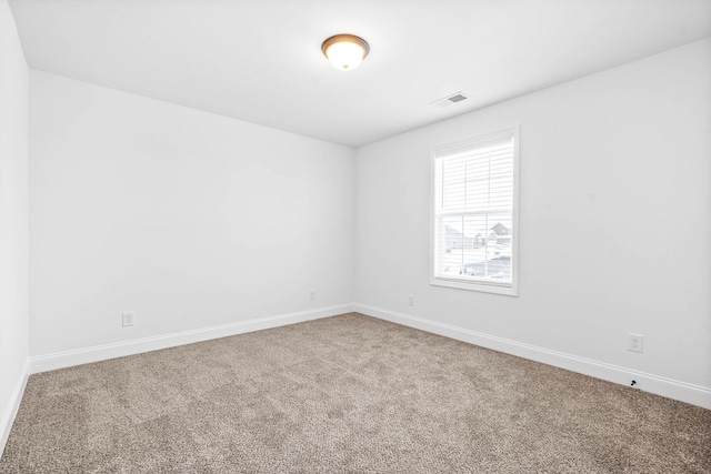 spare room with carpet floors