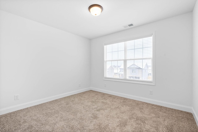 unfurnished room featuring carpet