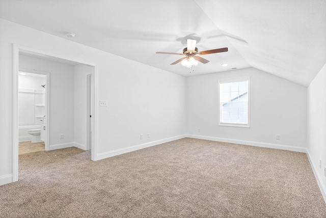 bonus room with ceiling fan, light colored carpet, and lofted ceiling