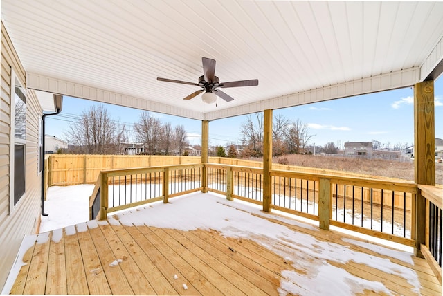 deck featuring a ceiling fan and fence