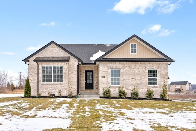 view of front of house with brick siding and board and batten siding