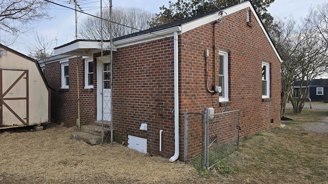 view of property exterior featuring a shed