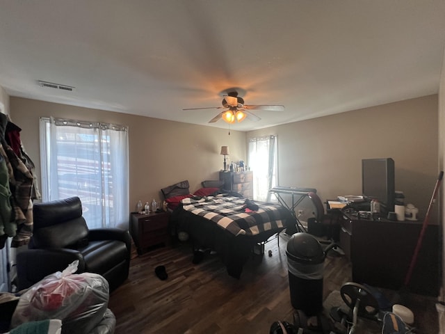 bedroom featuring ceiling fan and dark wood-type flooring