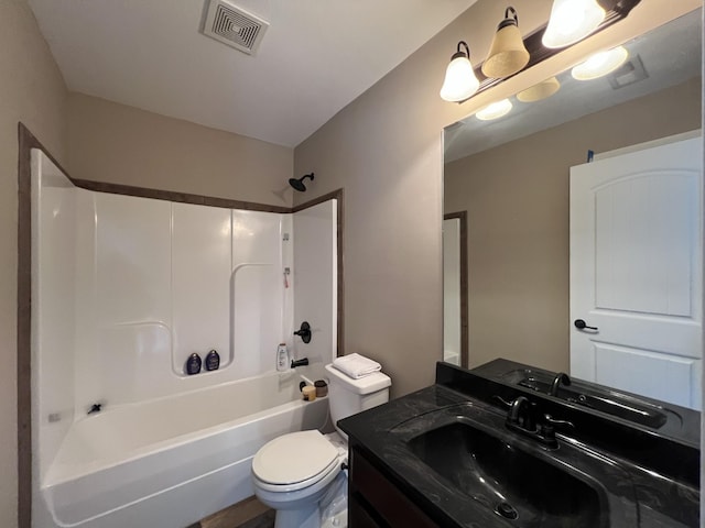 full bathroom featuring toilet, vanity, and washtub / shower combination