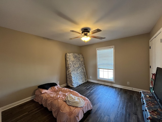 bedroom featuring ceiling fan and dark hardwood / wood-style floors