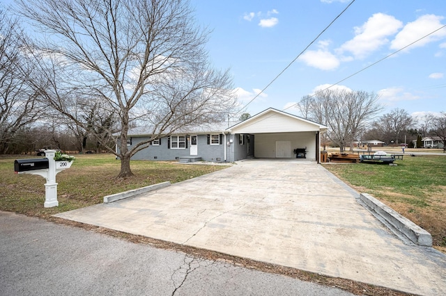 view of front facade featuring a front yard and a carport