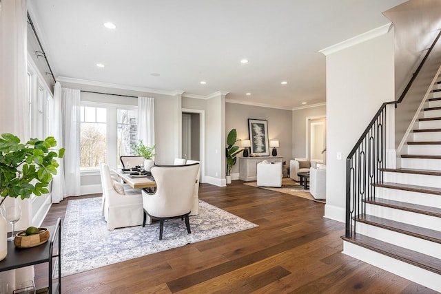 dining area with crown molding and dark wood-type flooring