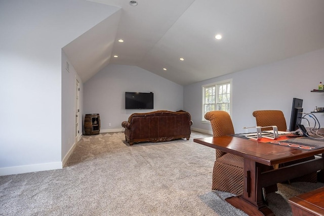 office area with lofted ceiling and light carpet