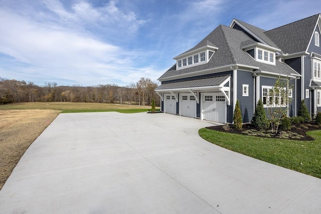 view of home's exterior featuring a lawn and a garage