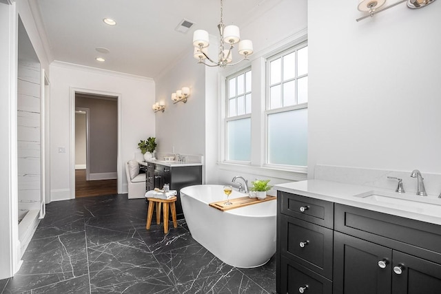 bathroom featuring vanity, a tub to relax in, an inviting chandelier, and crown molding