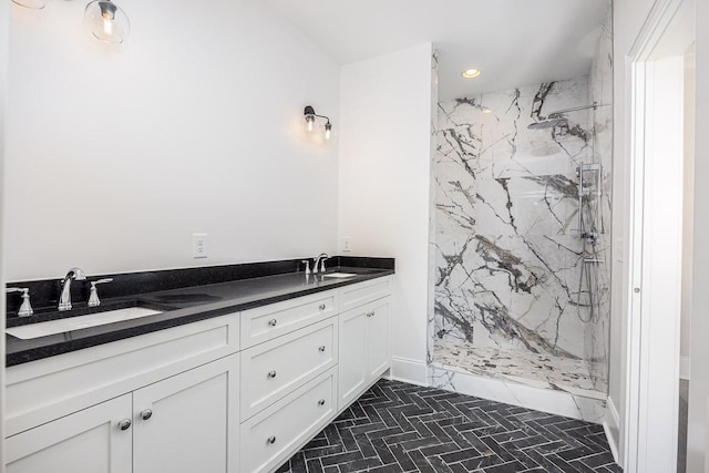 bathroom featuring vanity and a tile shower