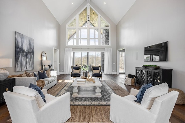 living room featuring a chandelier, dark hardwood / wood-style floors, and high vaulted ceiling