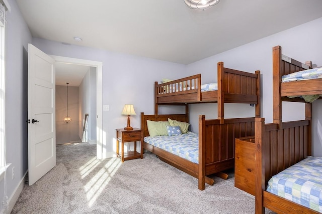 bedroom featuring light carpet