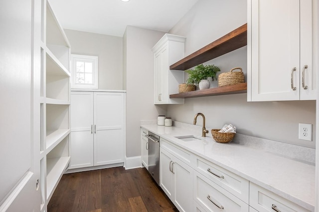 interior space featuring white cabinets, dishwasher, sink, and dark wood-type flooring