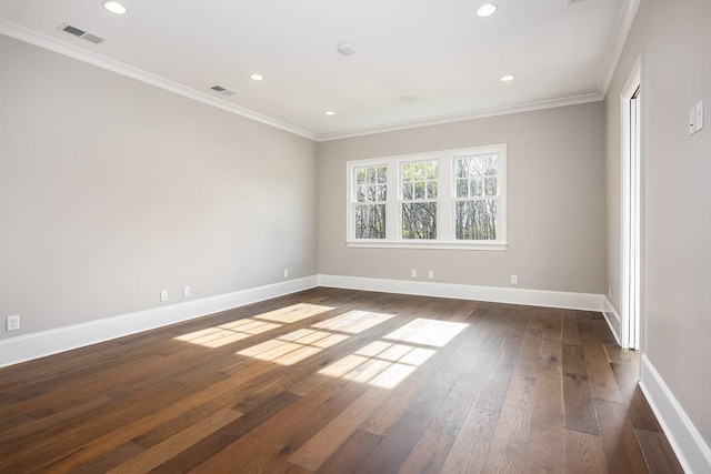 unfurnished room featuring crown molding and dark wood-type flooring