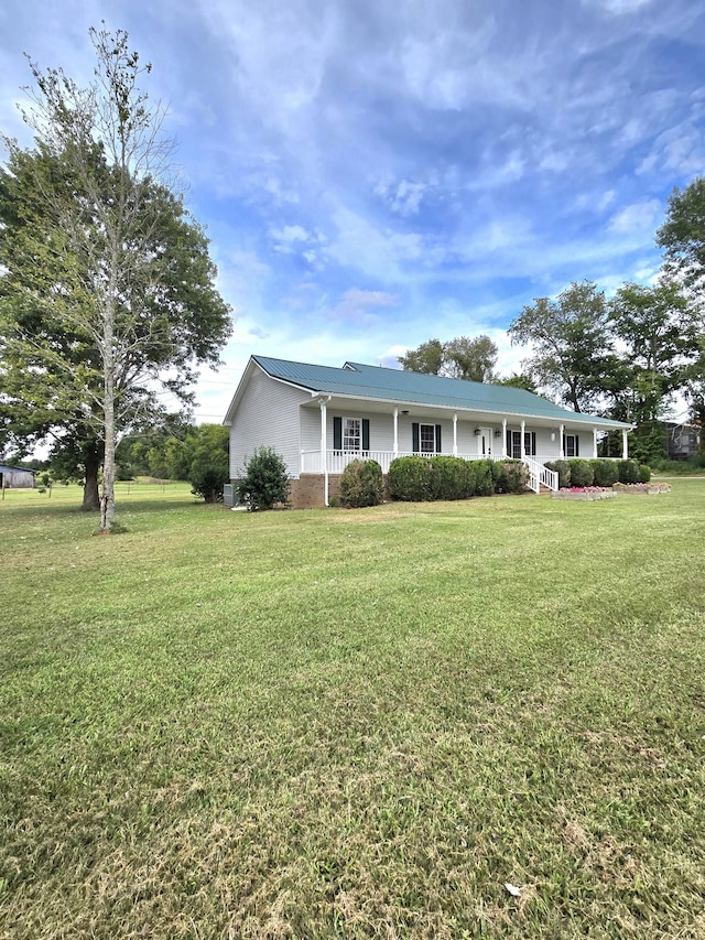 ranch-style house with a front lawn and a porch