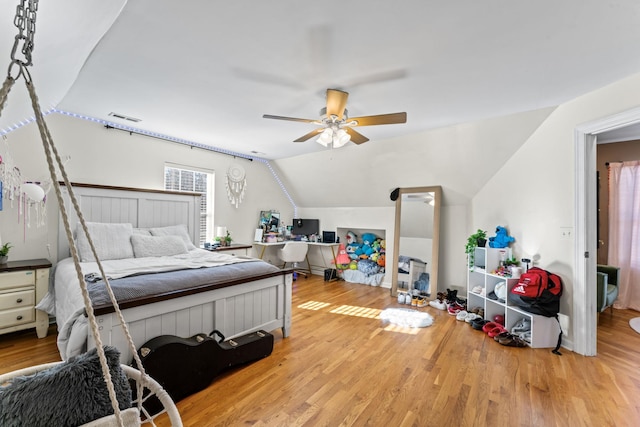 bedroom featuring vaulted ceiling, ceiling fan, and light hardwood / wood-style floors