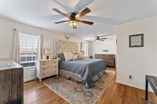 bedroom featuring ceiling fan and wood-type flooring