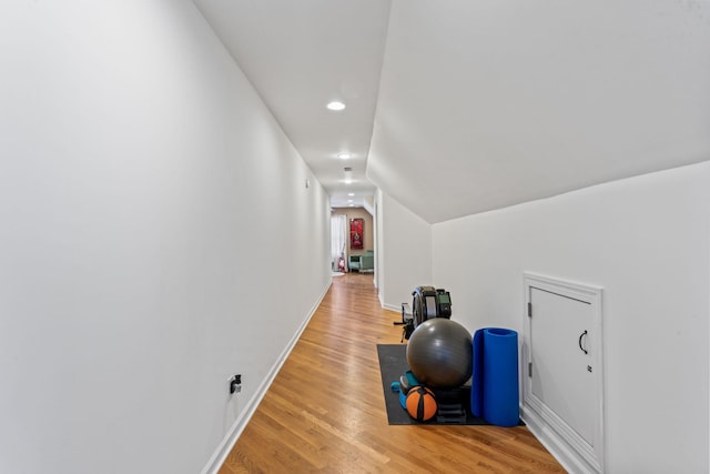 interior space with hardwood / wood-style floors and lofted ceiling