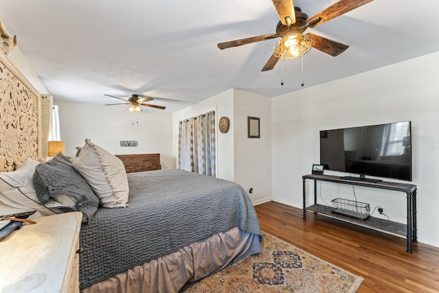 bedroom featuring dark wood-type flooring and ceiling fan