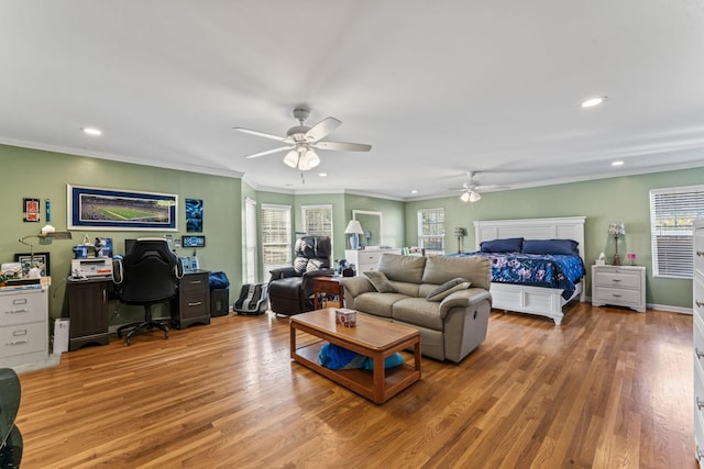 bedroom with ceiling fan, hardwood / wood-style flooring, and ornamental molding