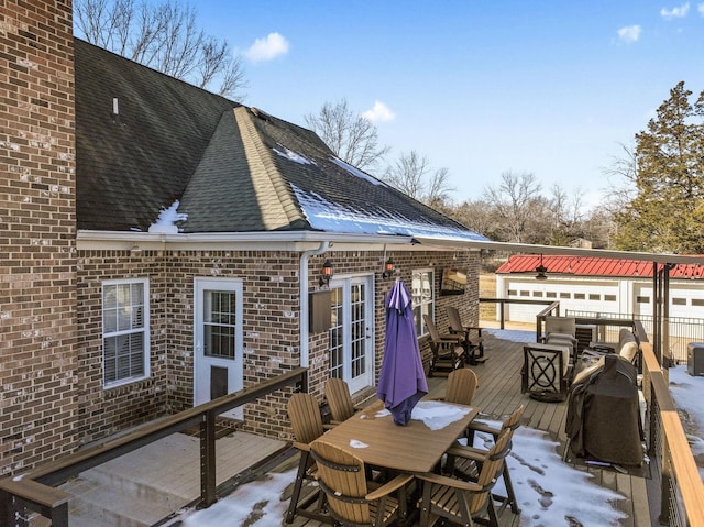 view of snow covered deck