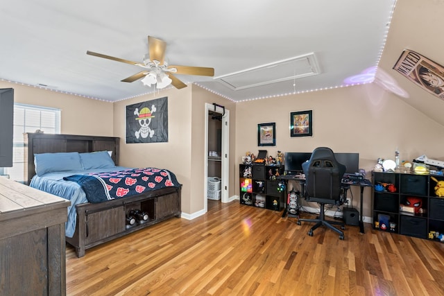 bedroom with ceiling fan and light wood-type flooring