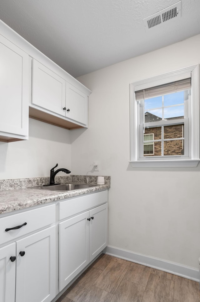 laundry area with sink