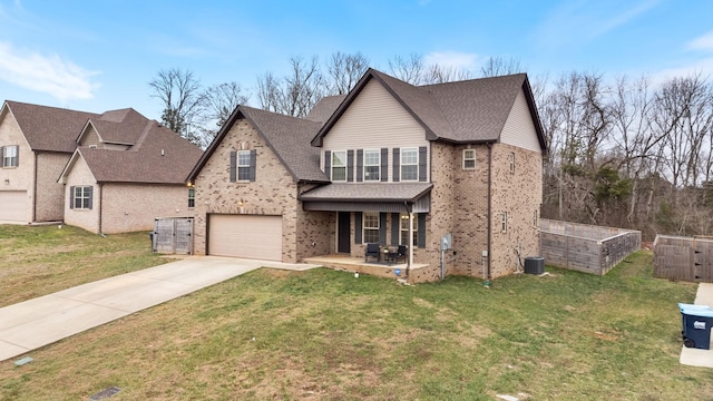 view of front of house featuring central AC, a garage, and a front lawn