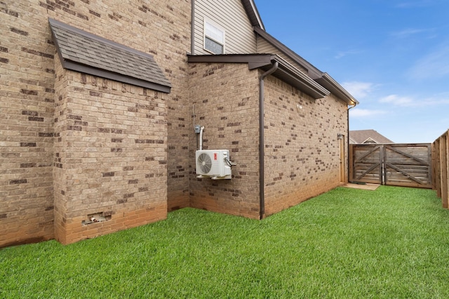 view of side of property with a lawn and ac unit