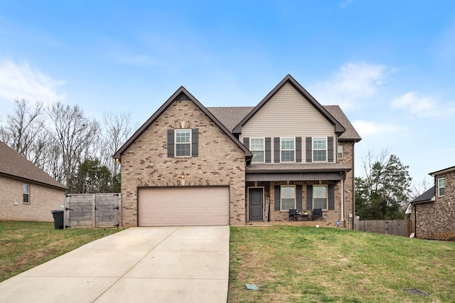 view of front of house featuring a front yard and a garage