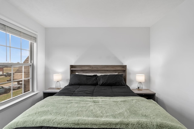 bedroom featuring multiple windows