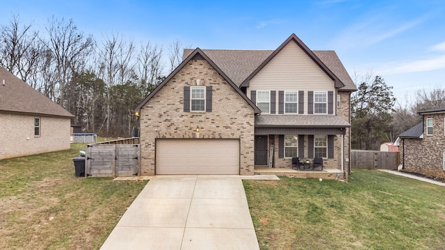 view of front of home featuring a front yard and a garage