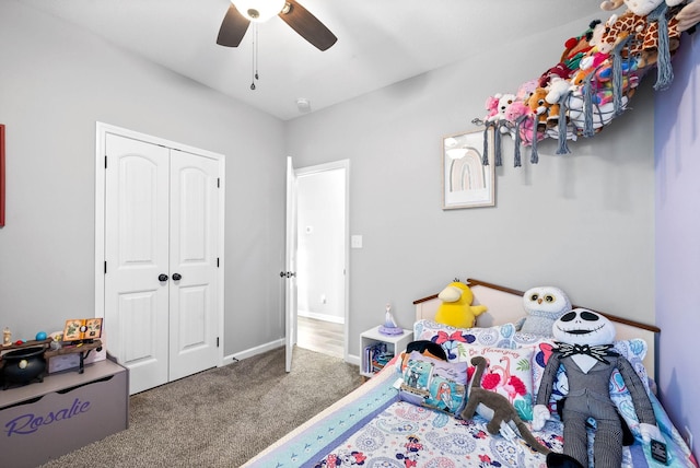 bedroom featuring ceiling fan, a closet, and carpet flooring