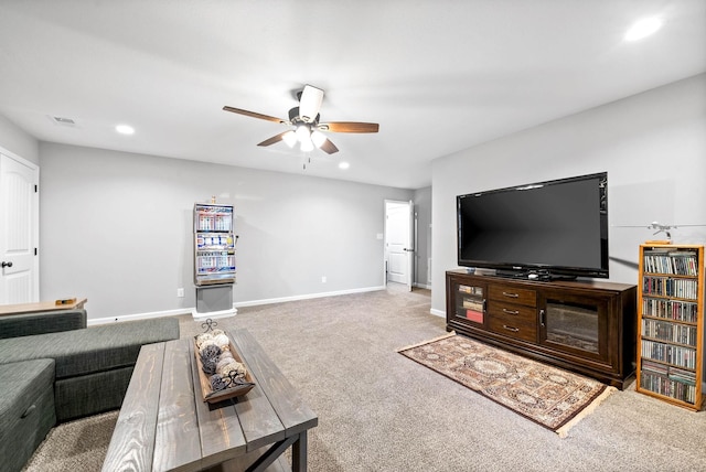 living room with ceiling fan and carpet floors